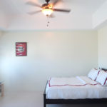 Icon Plaza Studio Apartment - BGC - bed and tv