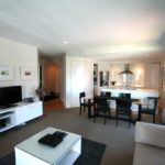 Auckland Viaduct Harbour 2 bedroom apartment - lounge, dining and kitchen