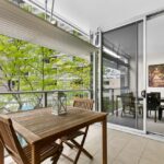 Shelley St, Sydney - apartment 407 balcony with outdoor table and chairs