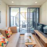 Realm apartments, Adelaide - one bedroom - living room and balcony
