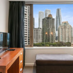 The Sebel, Quay West apartment - study with view of Sydney