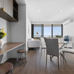 Realm Apartments, Adelaide - Apartment 1404 - living room and dining and study desk